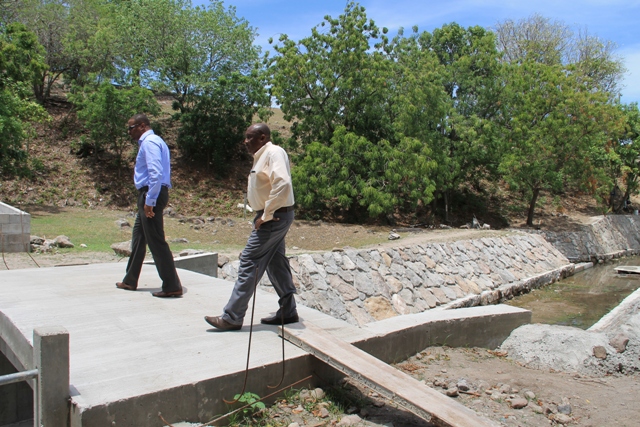 Deputy Premier of Nevis and Minister of Tourism Hon. Mark Brantley (l) and Permanent Secretary in the Ministry of Tourism Carl Williams touring ongoing works at the Bath Stream on June 28, 2016